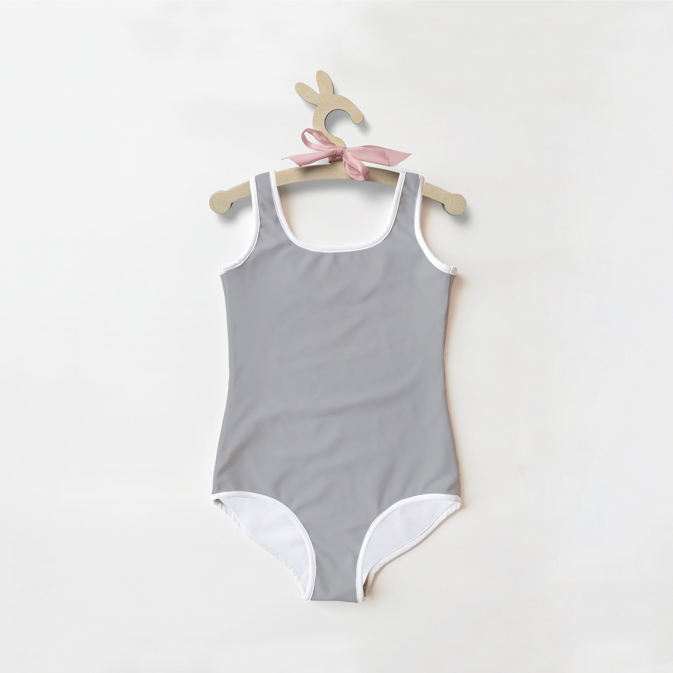 Gray girls one-piece swimsuit with white trim made of soft stretchy fabric and upf 50 plus sun protection