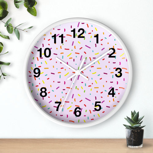 Girls colorful sprinkles silent wood wall clock with a pink sprinkle face black numerals and a white frame