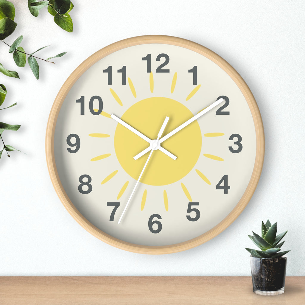 Yellow sun silent wood wall clock with light wood frame, cheerful yellow sun design, and black numerals on off-white face
