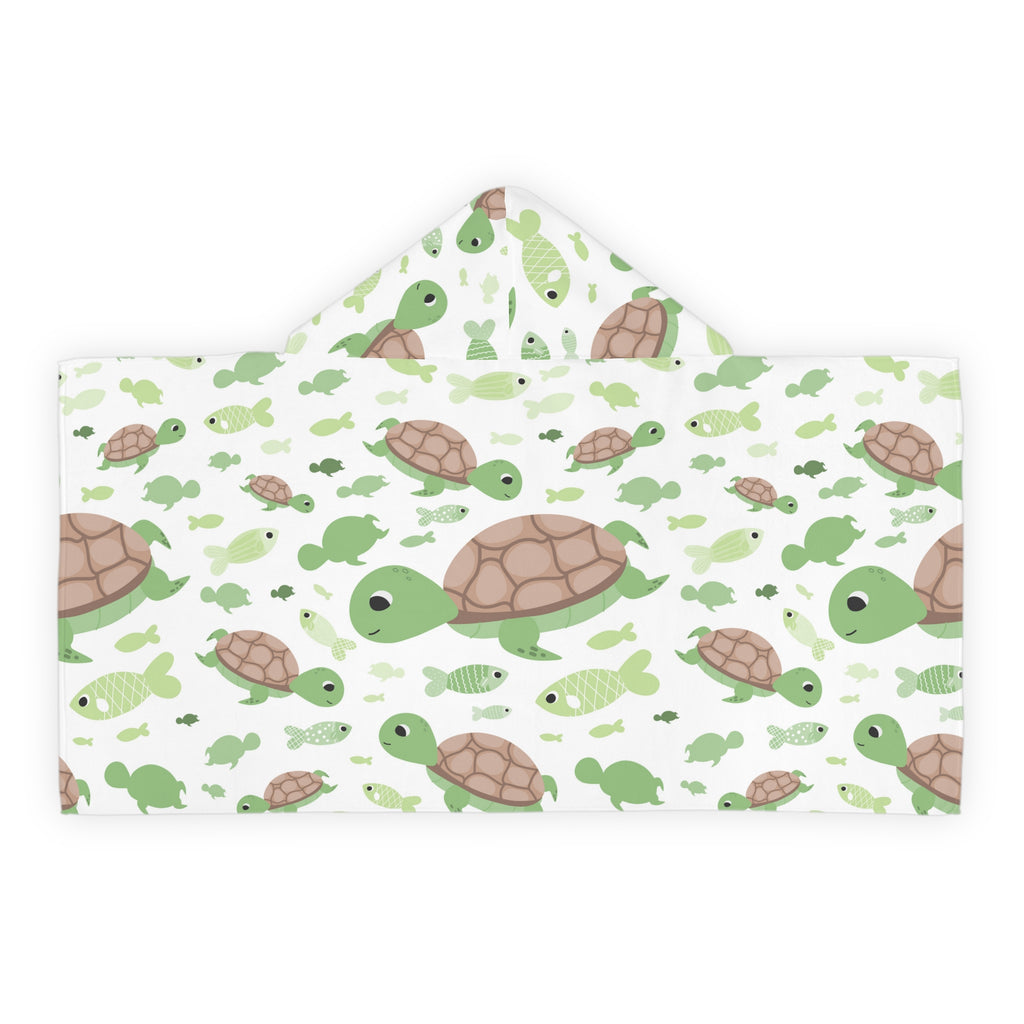 A soft white hooded towel with green and brown cartoon turtles and fish for kids bath and beach use