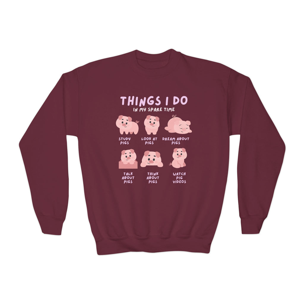 Kids maroon long-sleeved sweatshirt with pink pig graphic and six cartoon pigs featuring the text things I do in my spare time