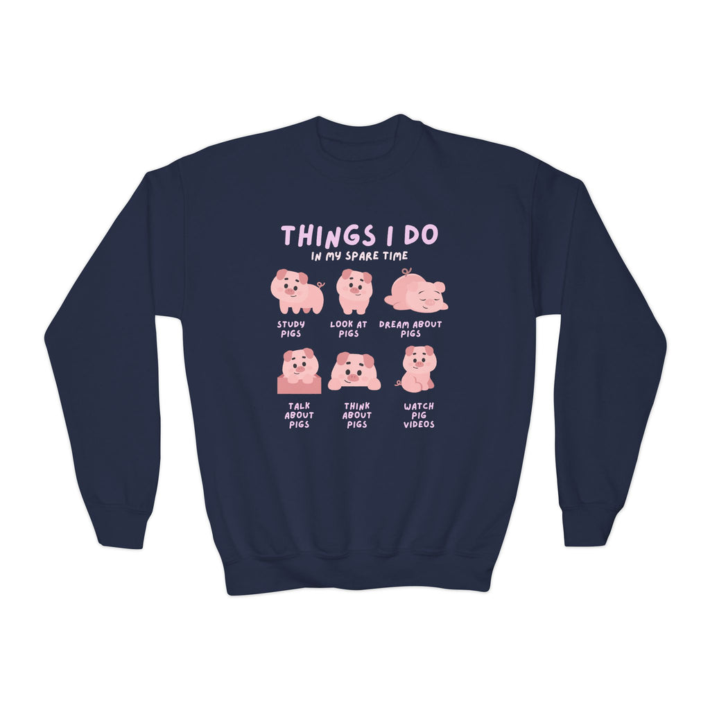 Navy blue kids sweatshirt with playful pink cartoon pigs and the text things i do in my spare time for cozy fun