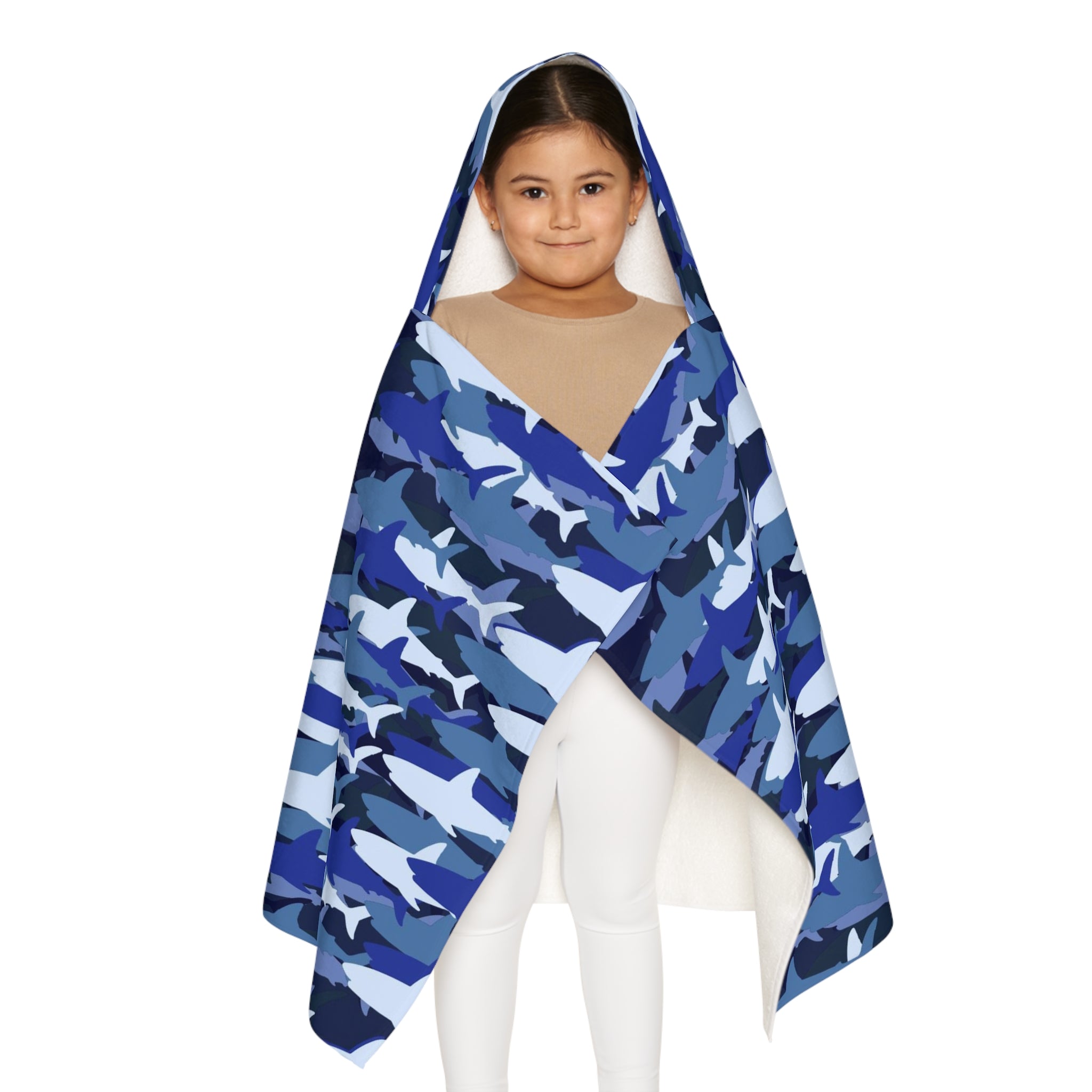 A child wearing a kids blue shark hooded towel with soft plush texture for bath and beach use