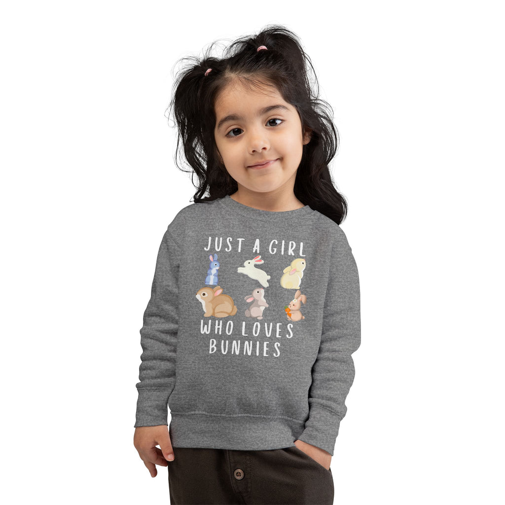Gray heathered girls sweatshirt featuring playful cartoon bunnies and white text just a girl who loves bunnies