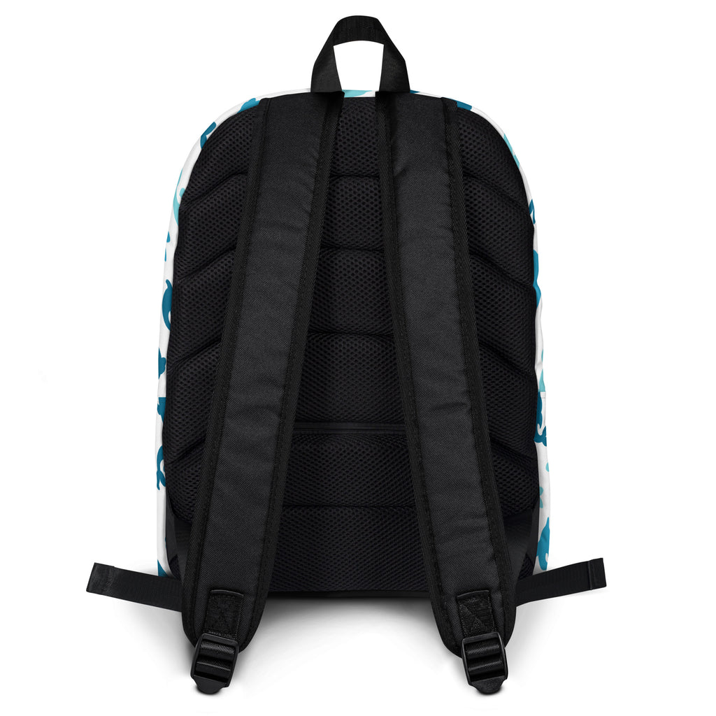 Kids dolphin print backpack showing back side with teal and white pattern and black mesh straps and back panel