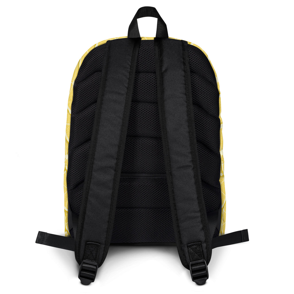 Kids lemon slice backpack black and yellow with mesh back panel and adjustable shoulder straps shown from back side