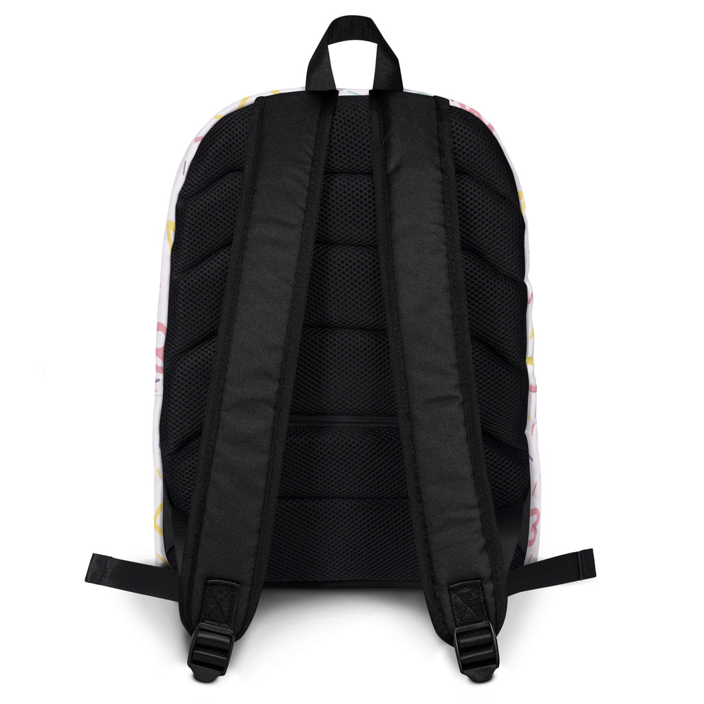 White girls hearts and sprinkles backpack with colorful pastel patterns and black mesh back panel and straps