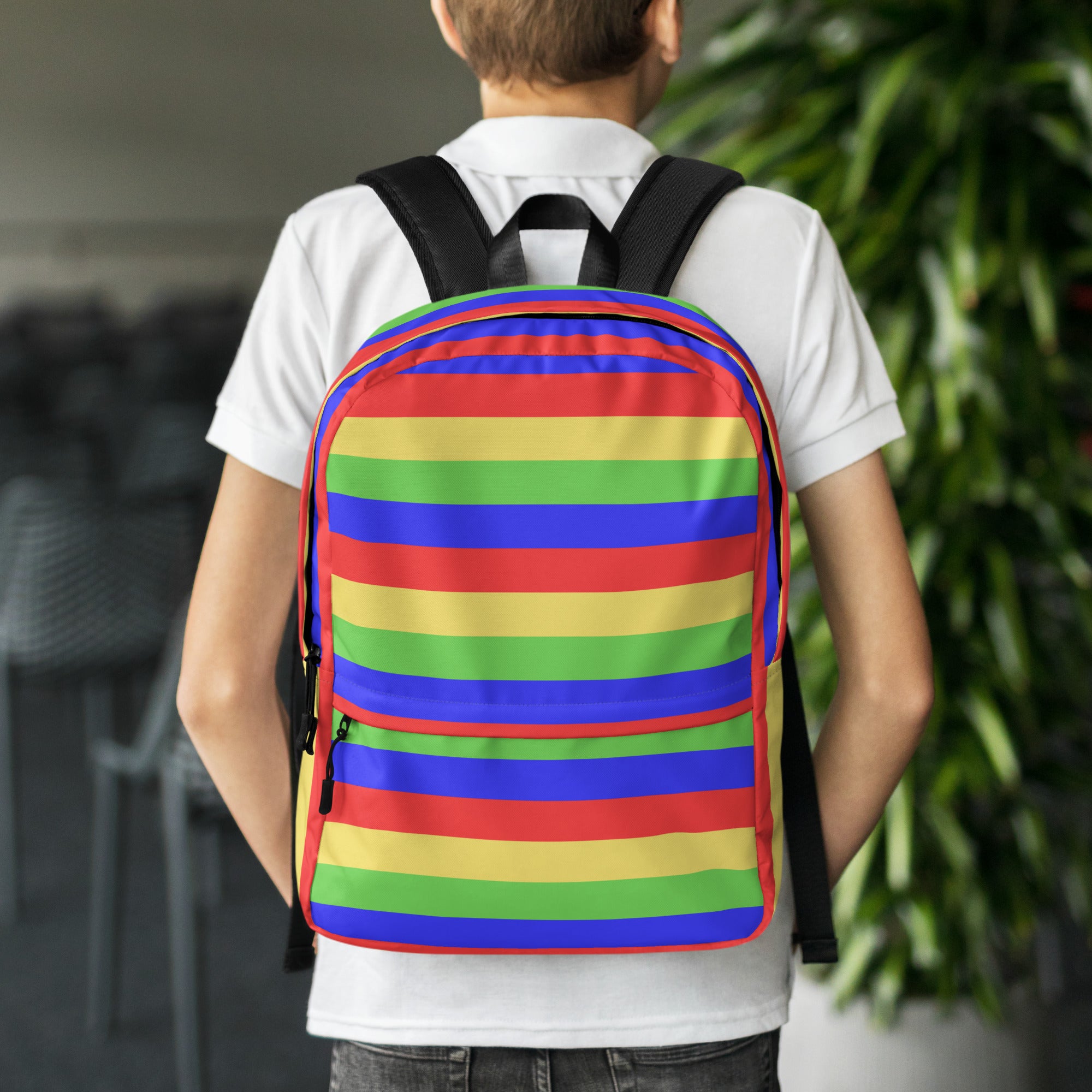 Kids colorful stripes backpack featuring vibrant rainbow horizontal bands of red orange yellow green blue and purple