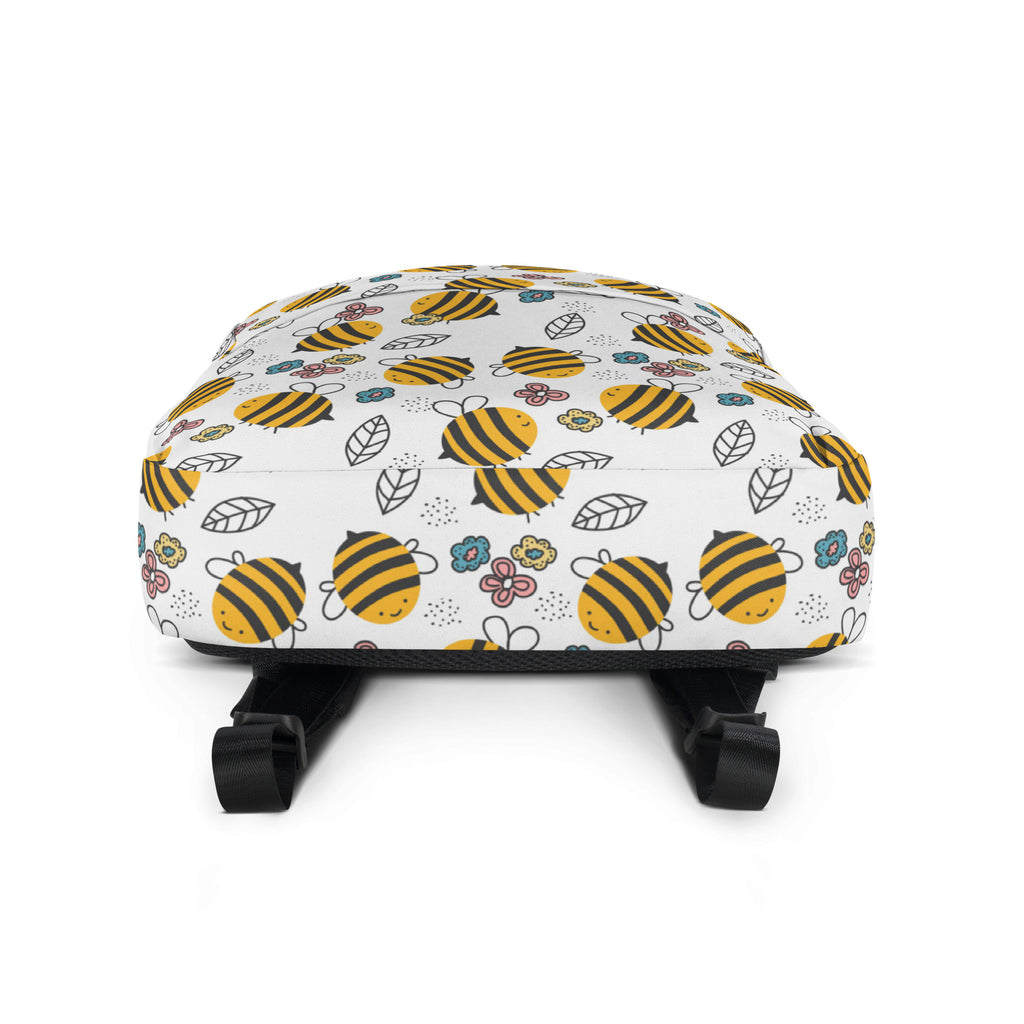 White kids floral bees backpack with playful yellow and black bee pattern and small flowers and leaves