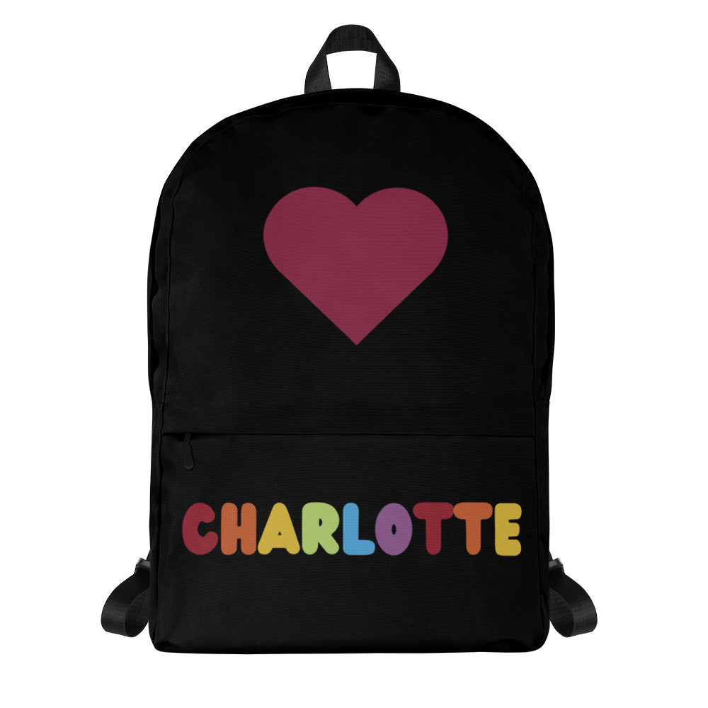 Black girls custom backpack with maroon heart and rainbow-colored name charlotte on the back side