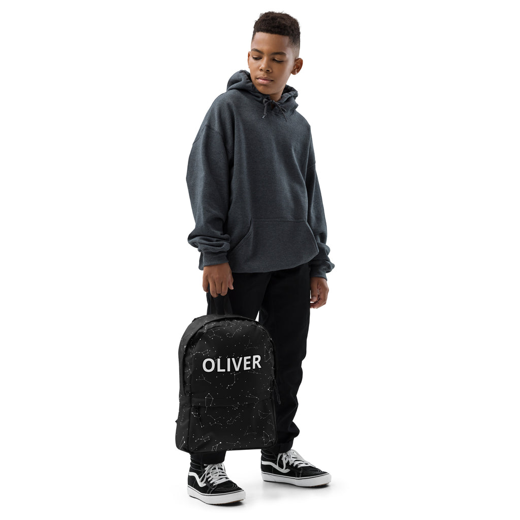 Black kids custom name backpack with white oliver lettering and speckled constellation pattern on front