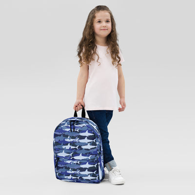 Kids blue sharks backpack featuring a blue fabric with white and darker blue shark pattern for school use