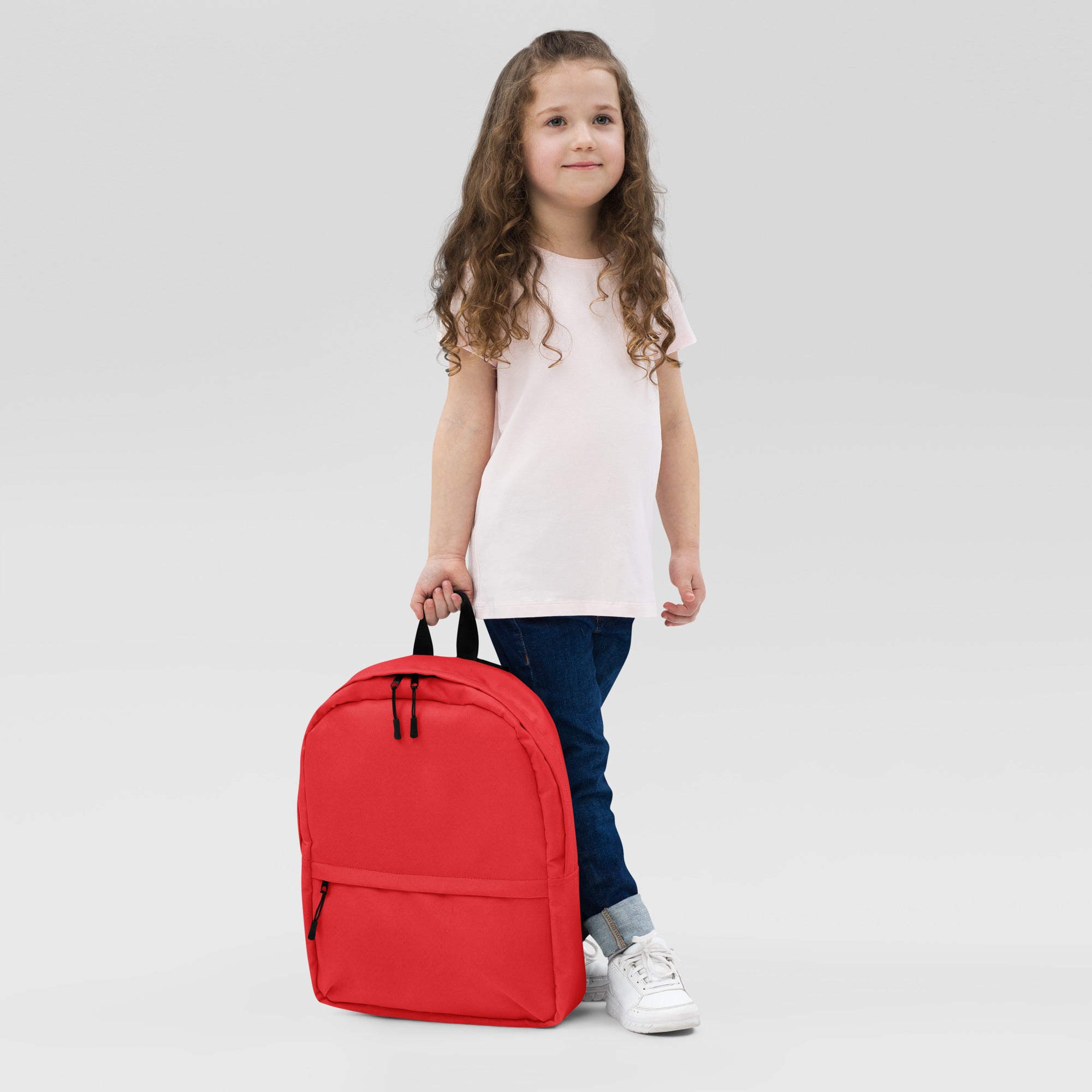 Kids red backpack with black zippers and handles featuring durable fabric for everyday use