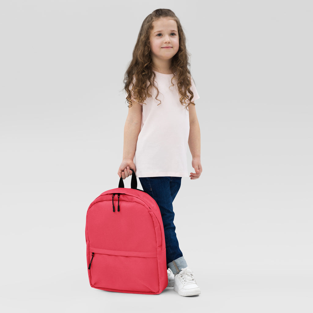 Girls pink backpack made of bright red durable fabric with black zippers and handles for everyday use