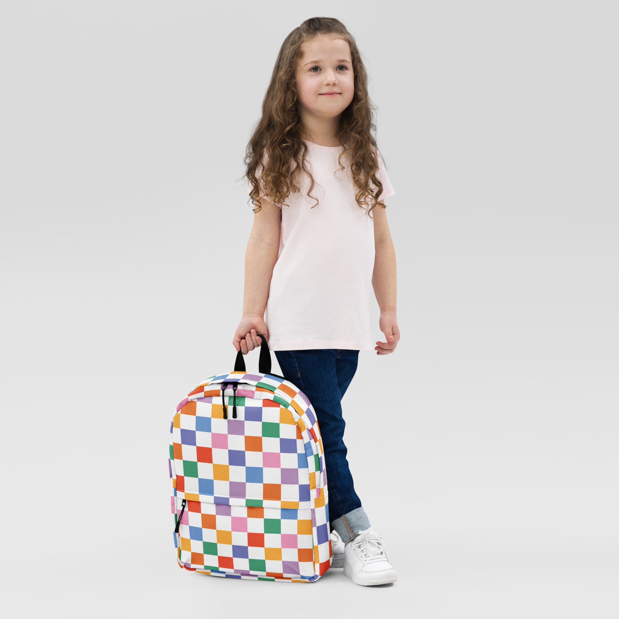 Kids rainbow checkerboard backpack with colorful checker pattern black straps and zippers for school use