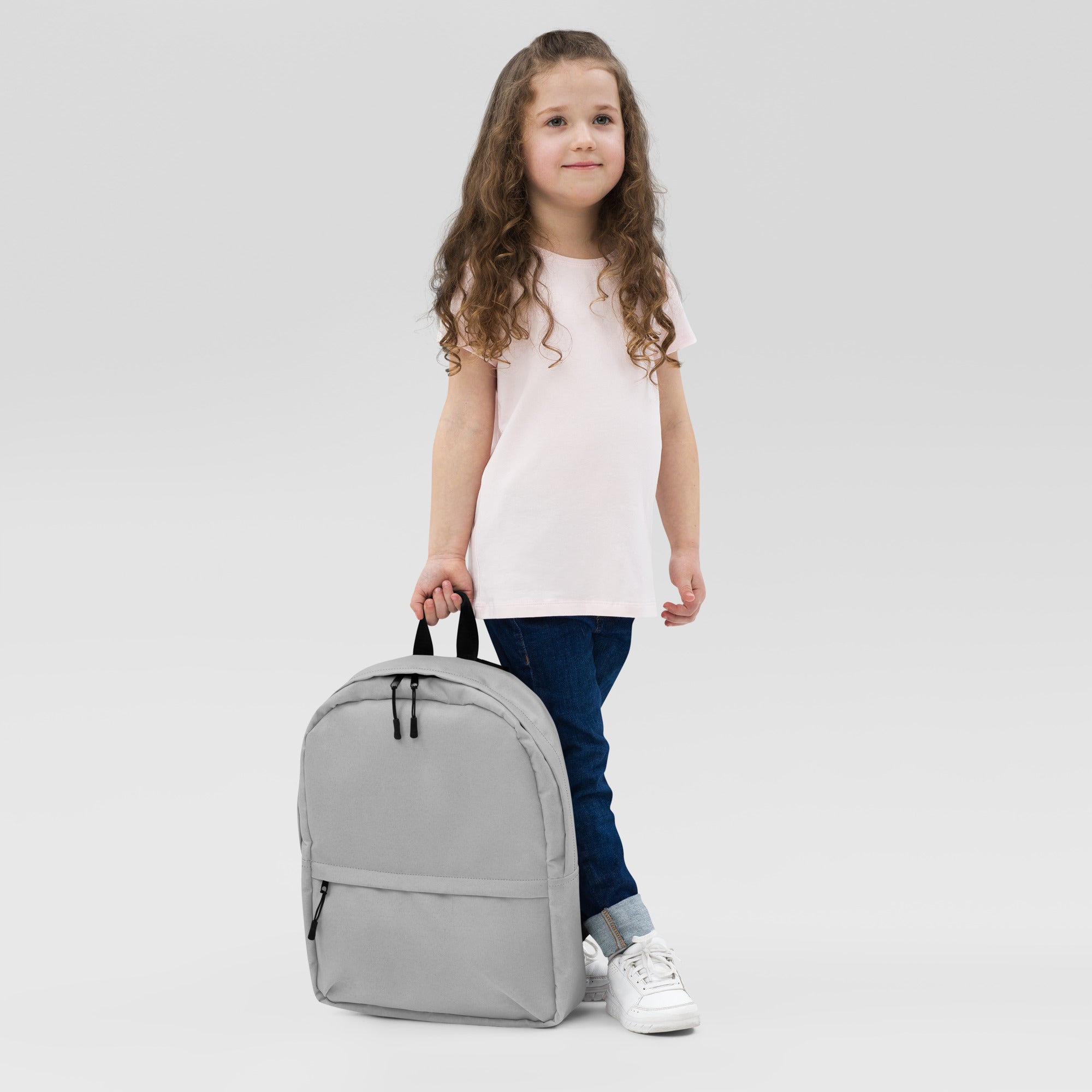 Kids gray backpack with black zippers and handles made of durable fabric for school and outdoor use