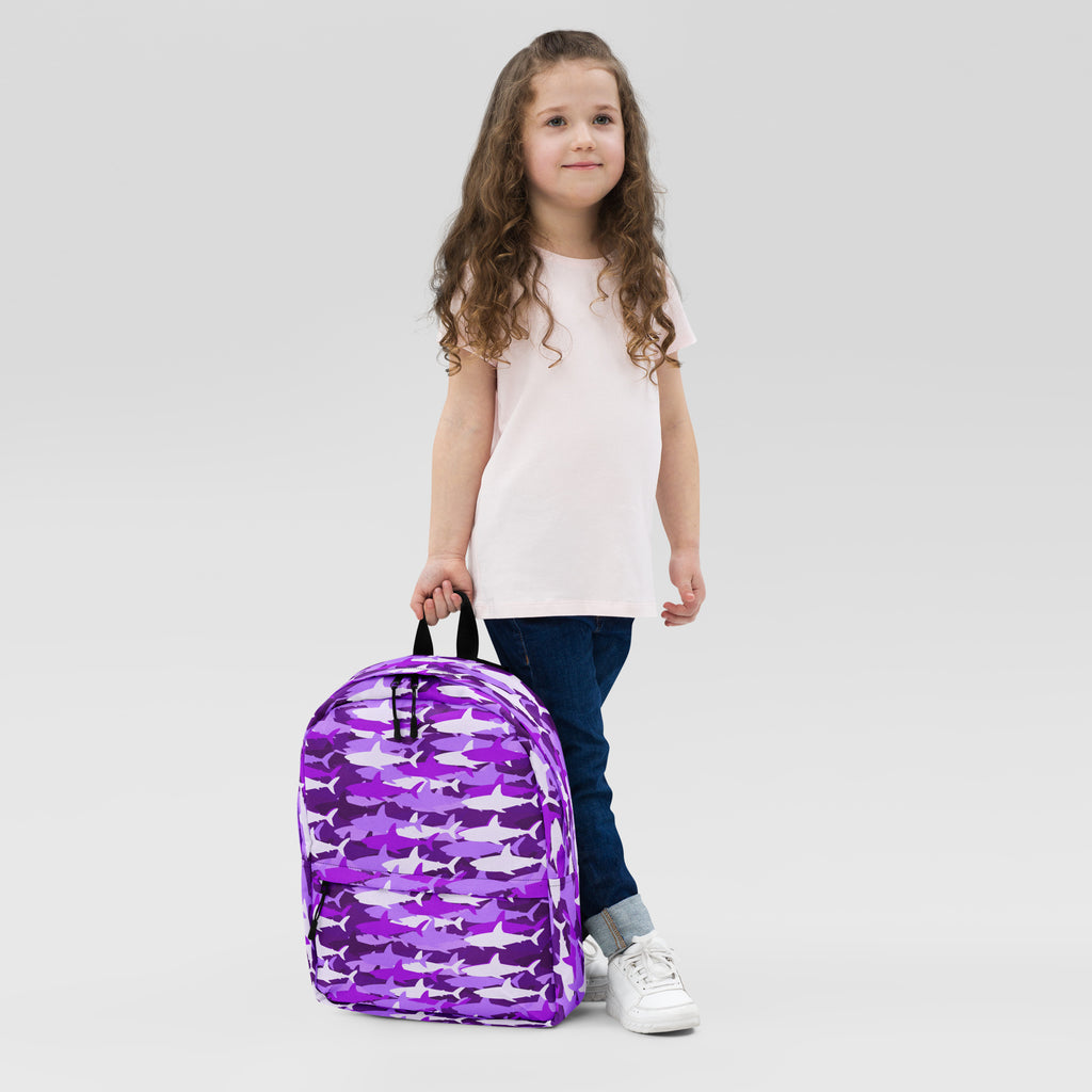 Girls purple backpack featuring a pattern of white and lighter purple sharks for school use
