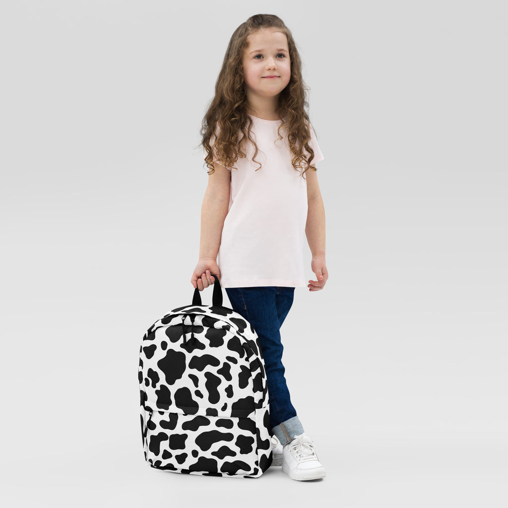Kids cow print backpack featuring a black and white bold cow pattern perfect for playful everyday use