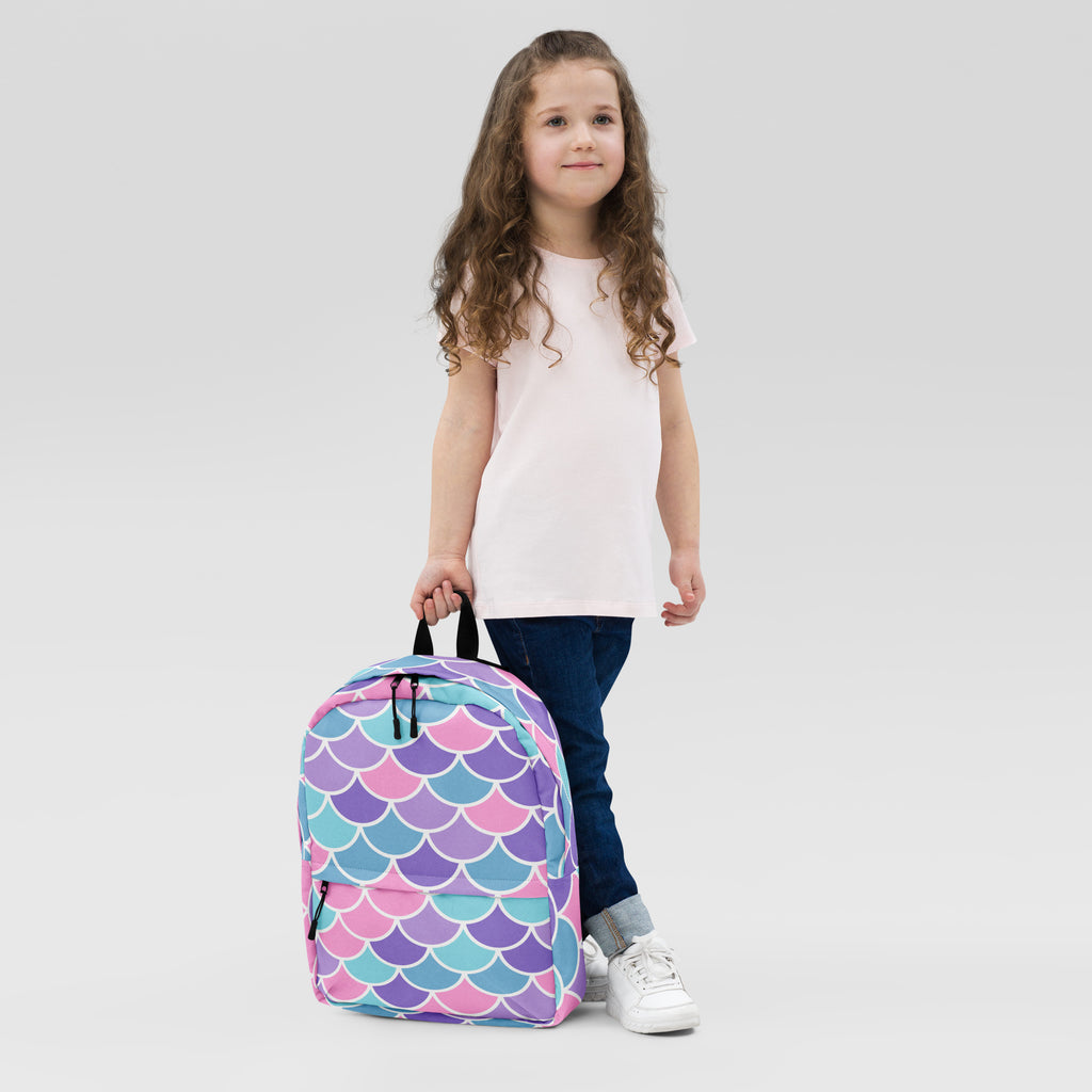 Girls mermaid scale backpack with colorful vibrant pink purple and teal mermaid scale pattern on the front