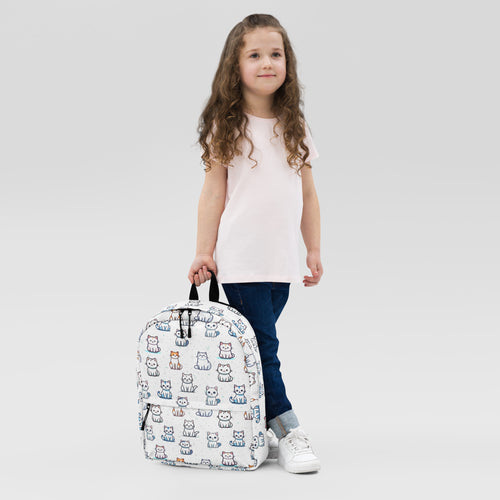 White girls backpack featuring a playful multicolor cartoon cat pattern ideal for school or daily use