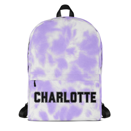 Girls custom name purple and white tie dye backpack with black straps and front pocket featuring charlotte text