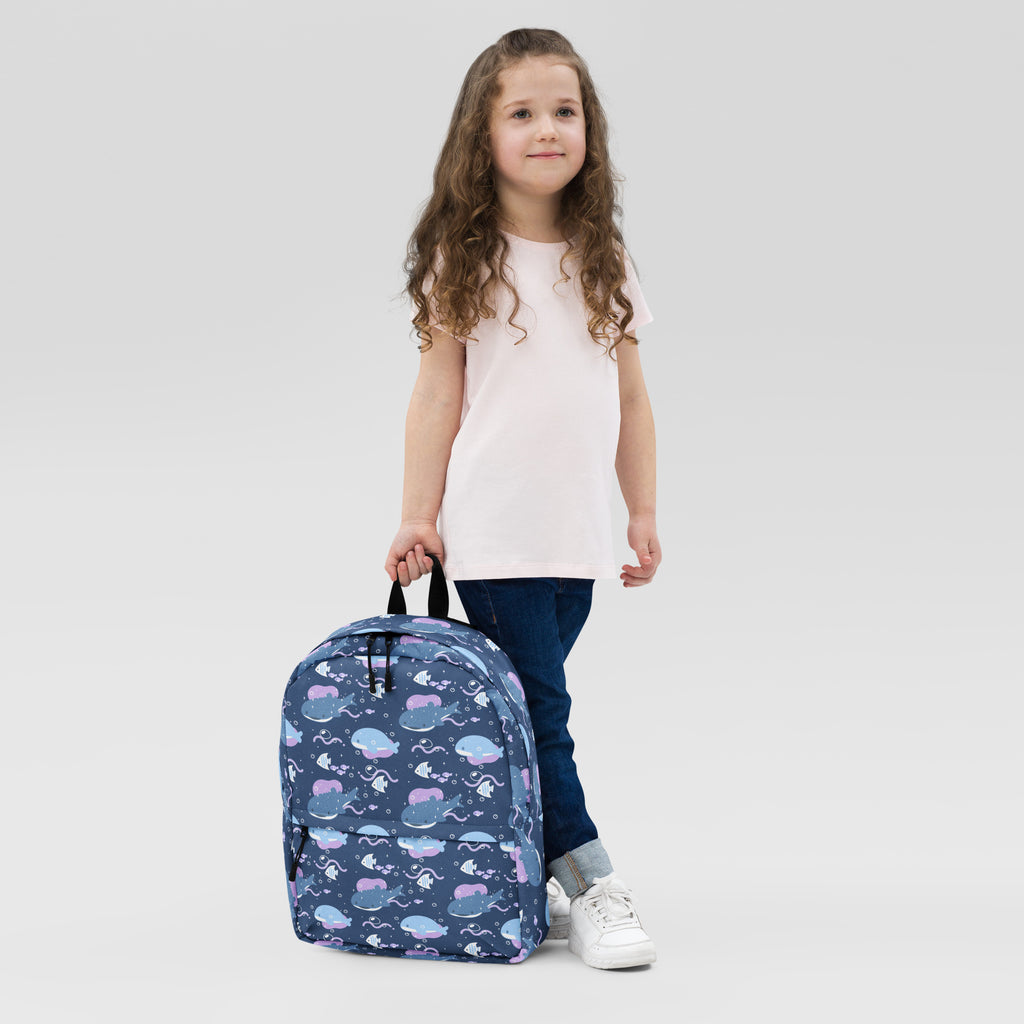 Girls whale shark backpack in navy blue with playful whales octopuses and fish pattern in purple and light blue