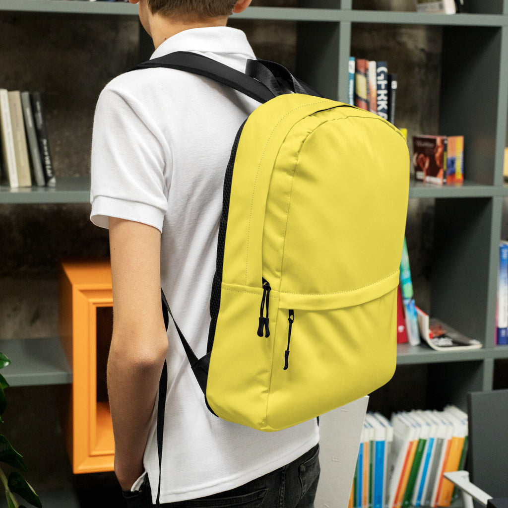 Kids yellow backpack with bright yellow fabric black straps and zipper pulls for school or casual use