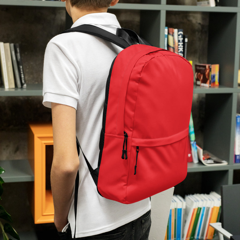 Kids red backpack made of nylon with black straps and zipper pulls shown from the front side