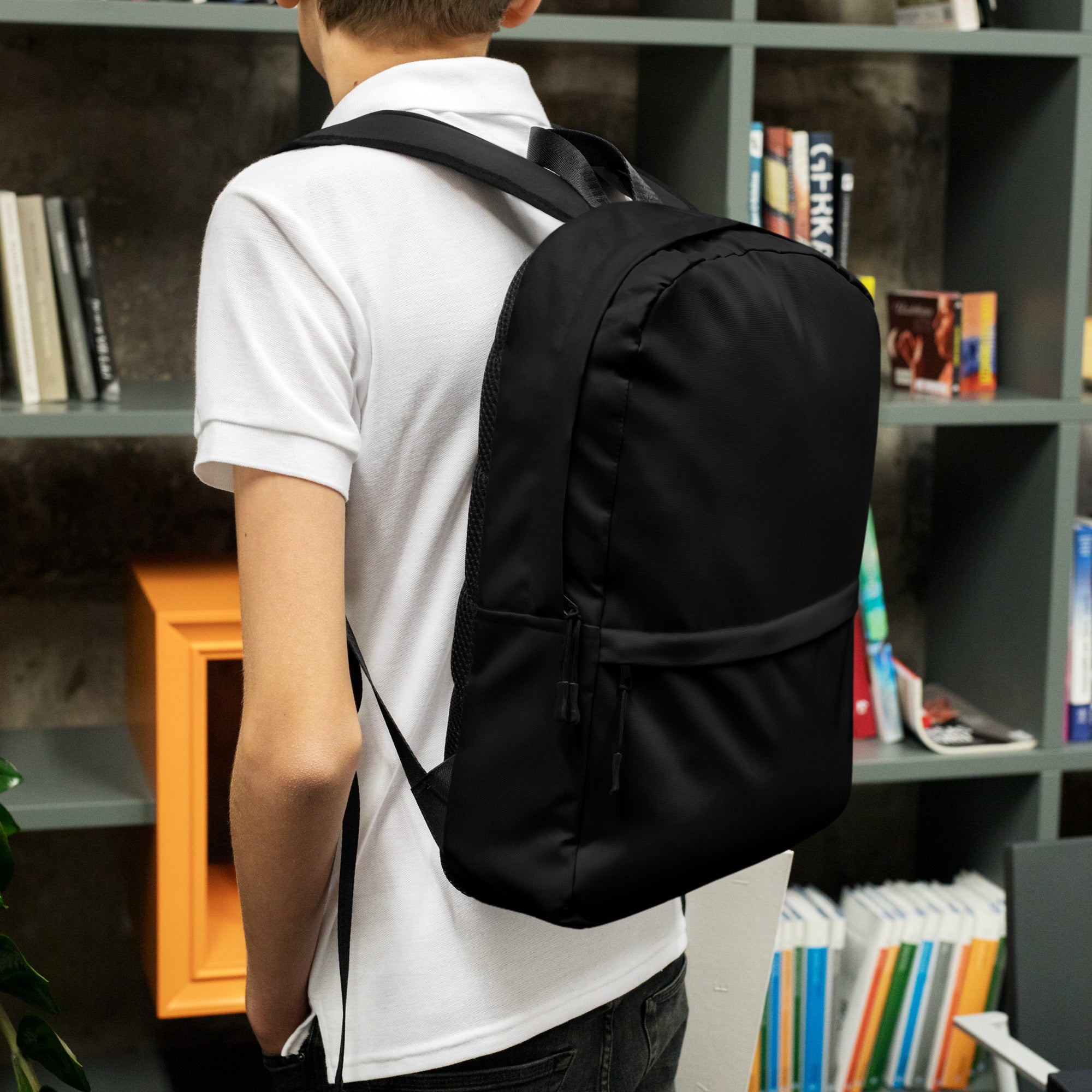 Kids black nylon backpack with adjustable shoulder straps and a front zippered pocket for easy storage