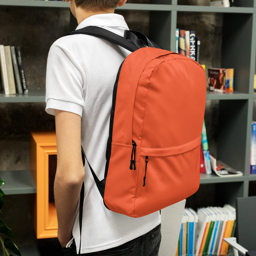 Kids orange backpack with black straps and zipper pulls designed for durable everyday use