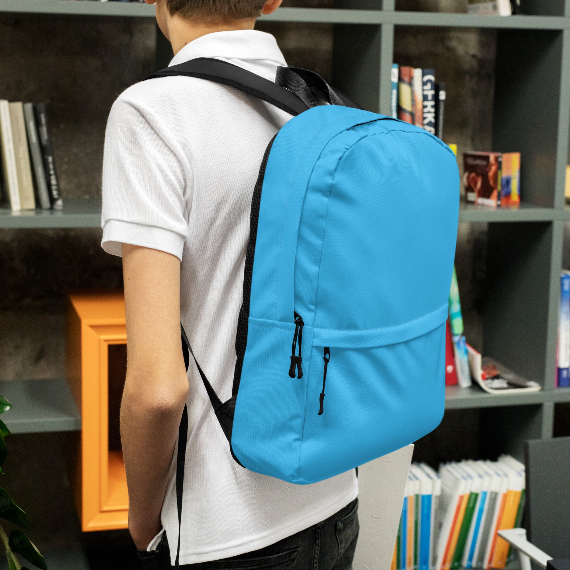 Kids sky blue backpack with bright blue fabric and black straps and zippers for school and daily use