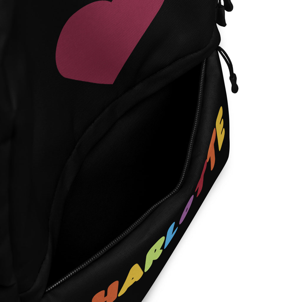 Black girls custom backpack with bold magenta heart and rainbow charlotte name lettering along zipper line