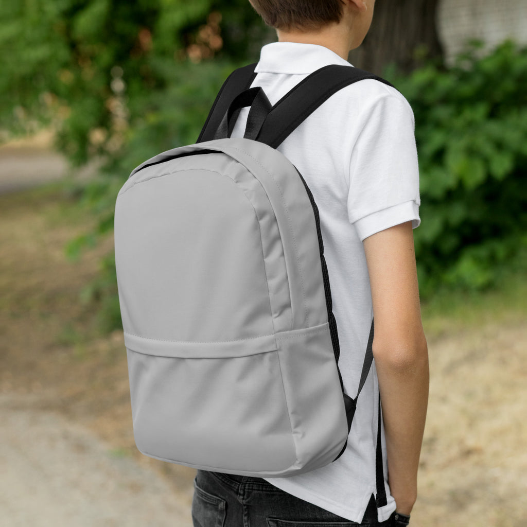 Kids gray backpack with black straps featuring a simple minimalist design shown from the back side