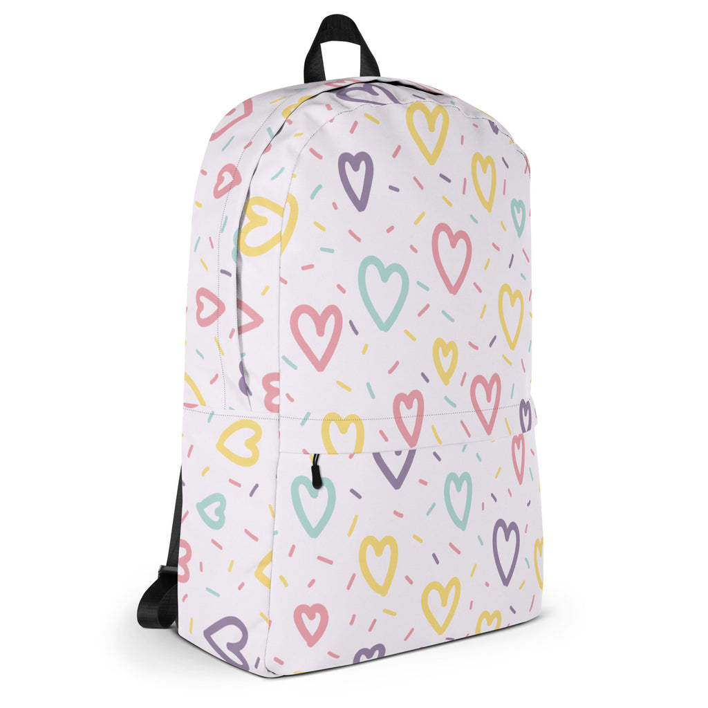 Girls hearts and sprinkles backpack in white with pastel heart and sprinkle pattern perfect for everyday use