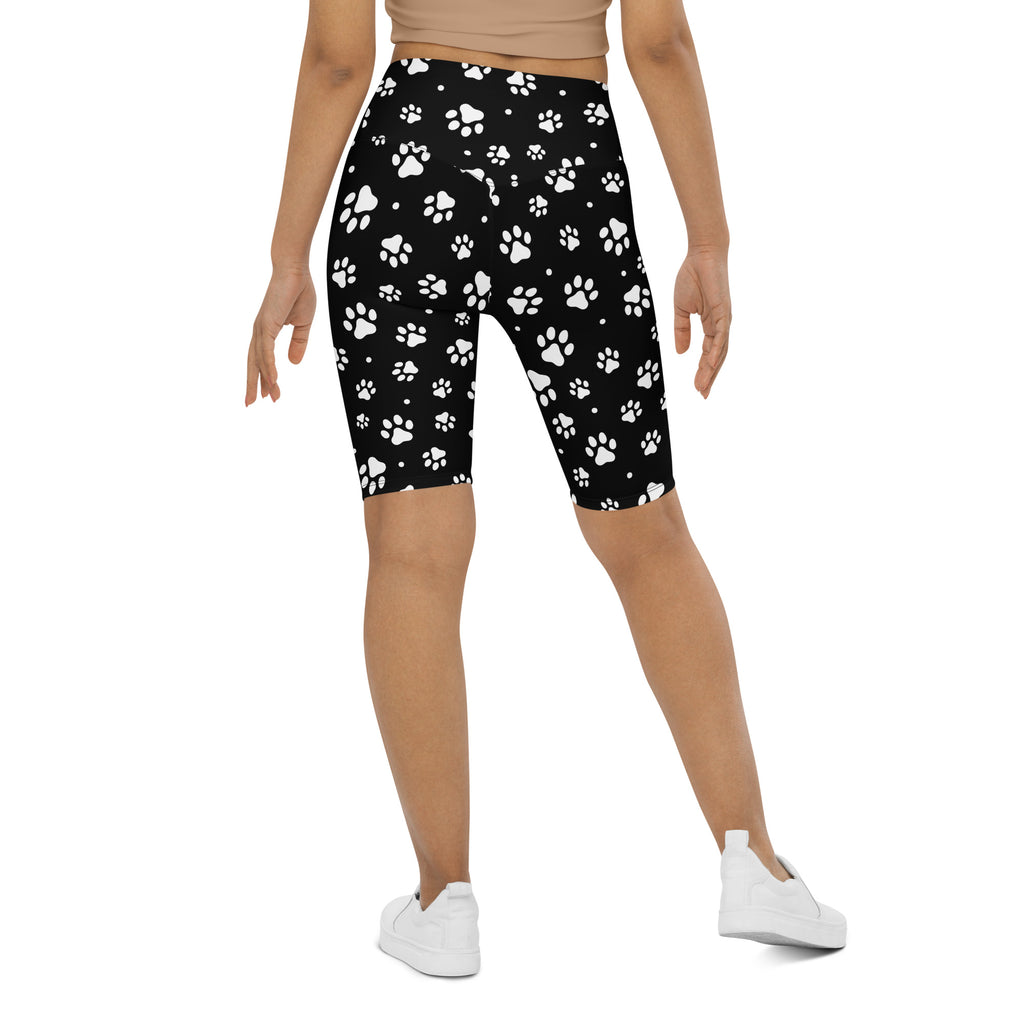 Women’s paw print high waisted biker shorts in black with white paw pattern moisture wicking active fit