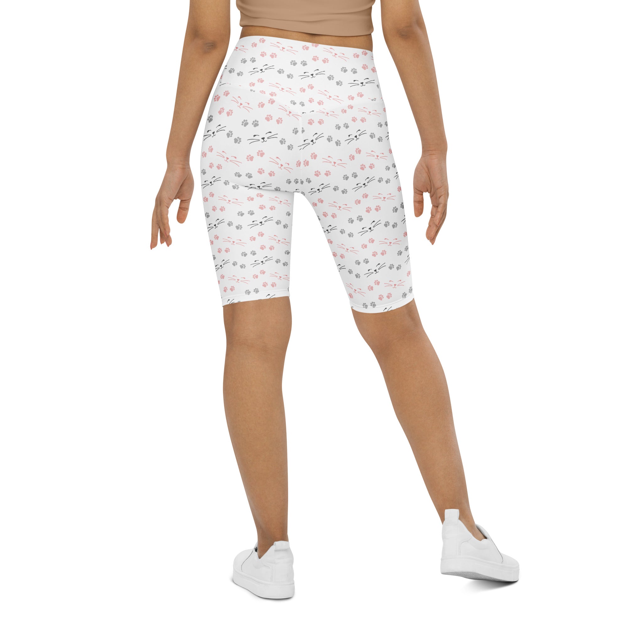 White women’s high waisted biker shorts with pink and gray cat paw prints moisture wicking active fit
