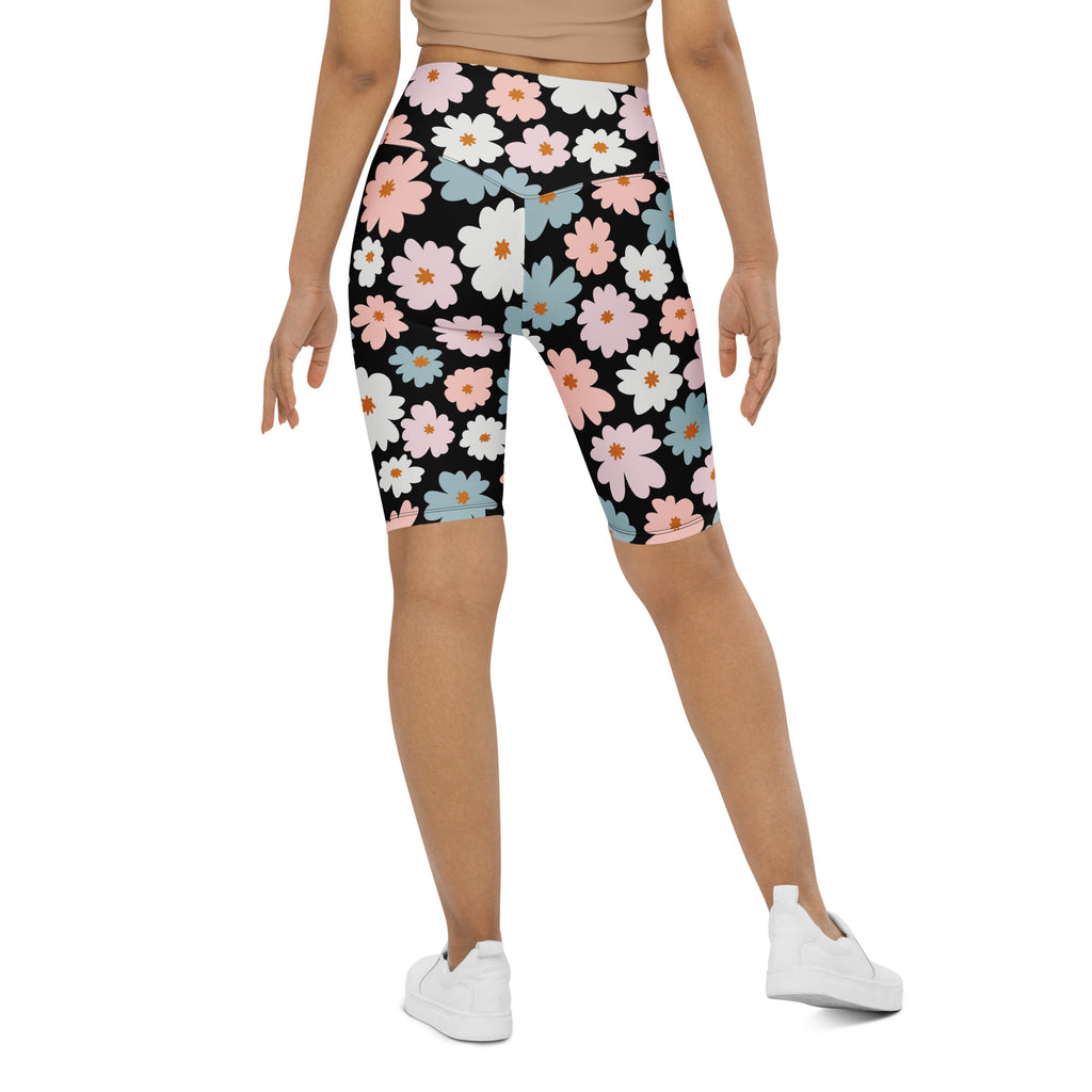 Women’s retro floral high waisted biker shorts in black with pink white and blue daisies moisture wicking active fit