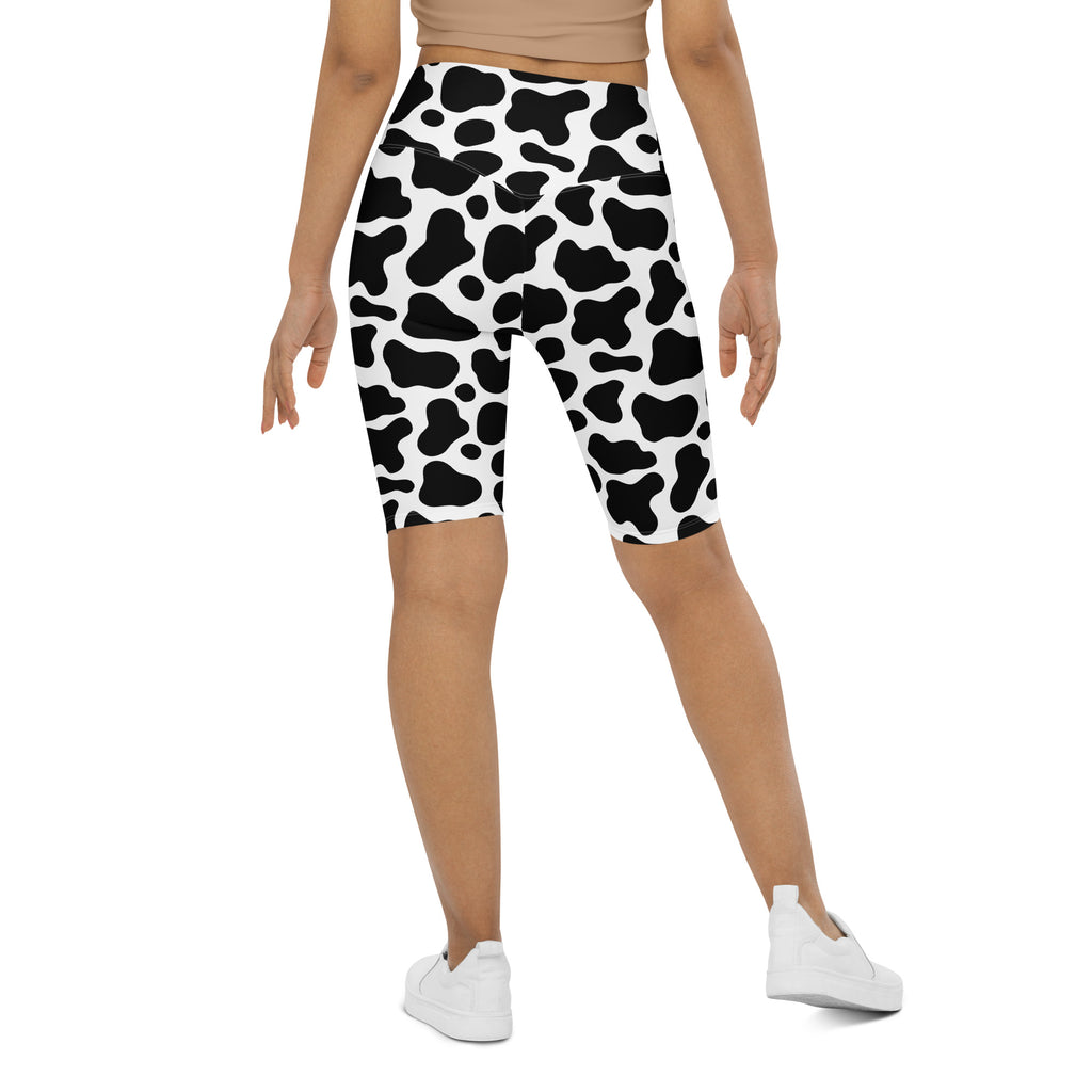 Women’s cow print high waisted biker shorts in black and white moisture wicking fabric for active fit