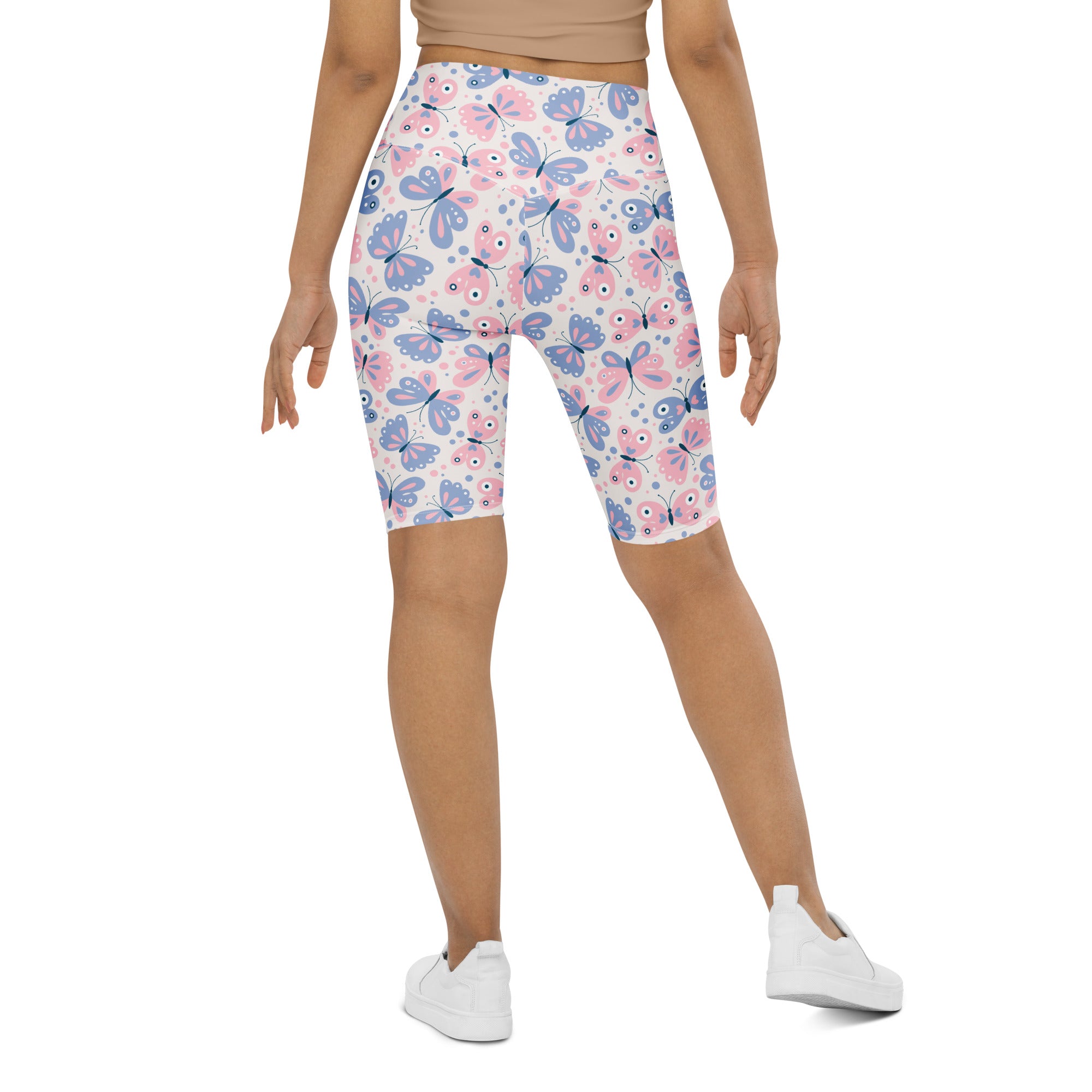 Women’s pink and blue butterfly print high waisted biker shorts with moisture wicking fabric for active fit