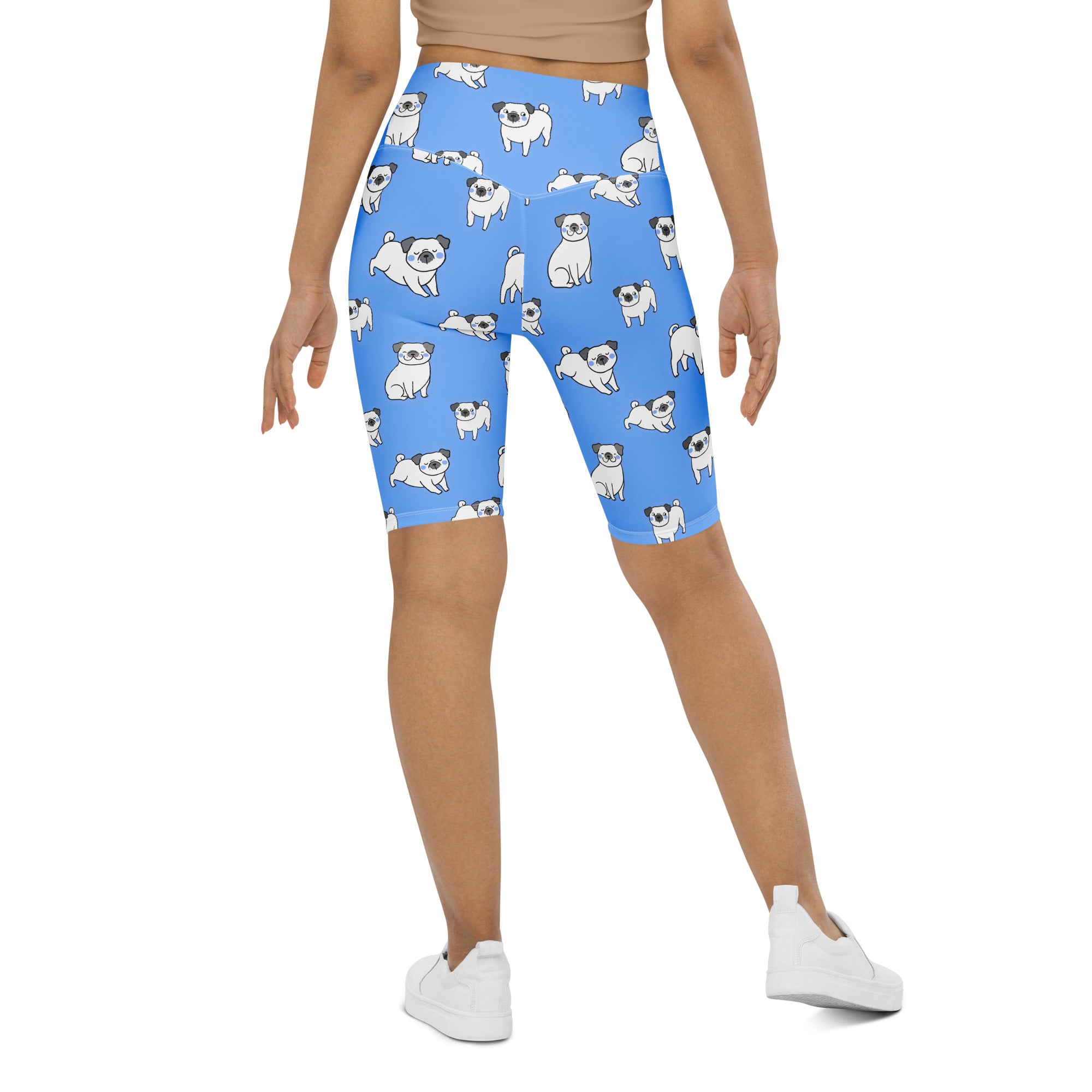Women’s blue high waisted moisture wicking biker shorts with a playful white pug dog pattern front view