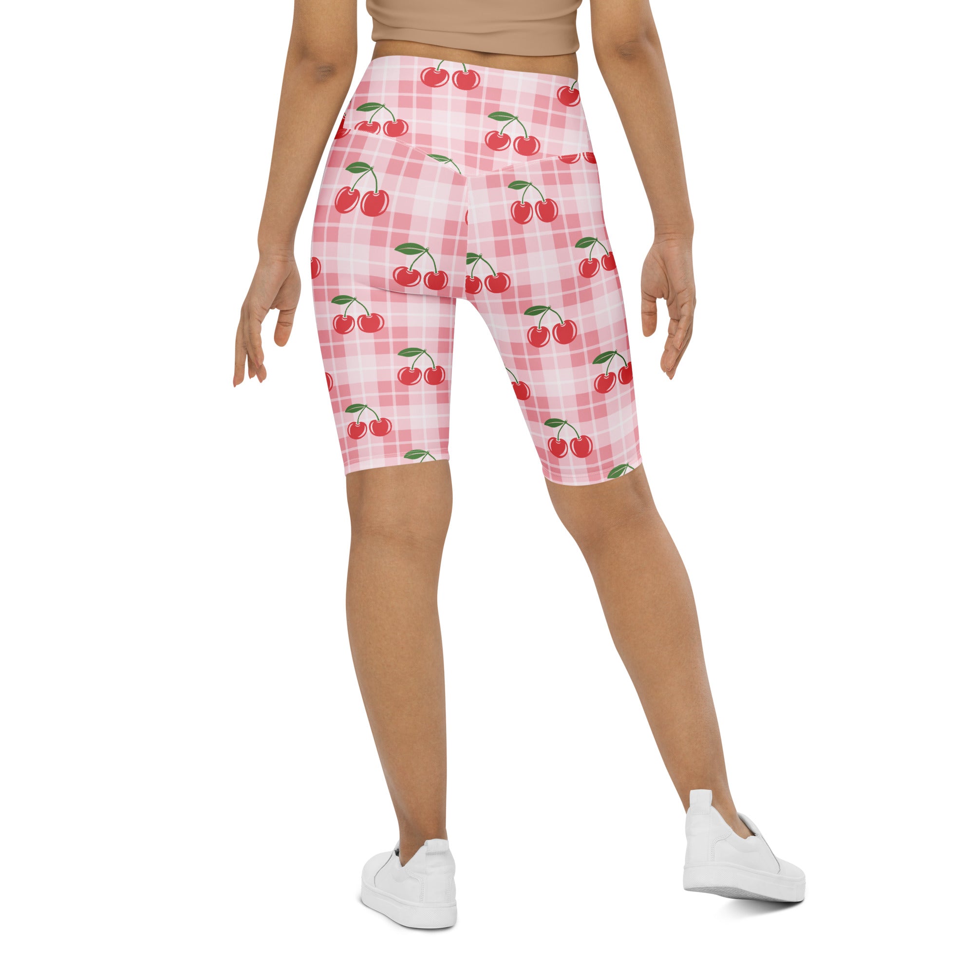 Pink gingham cherry high waisted biker shorts with moisture wicking fabric and plaid pattern for active fit