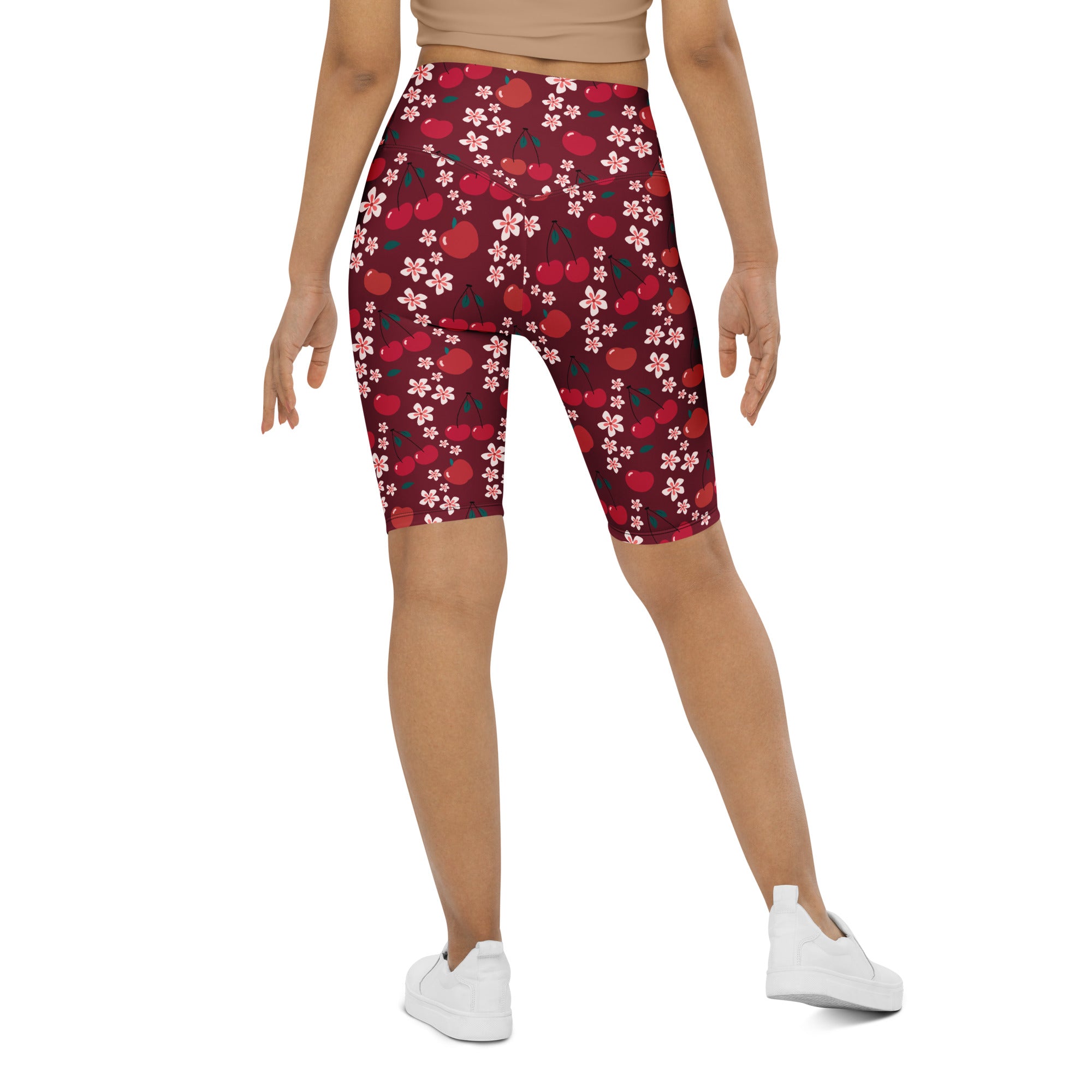 Women’s burgundy cherry daisy high waisted biker shorts with moisture wicking fabric and playful apple cherry blossom pattern