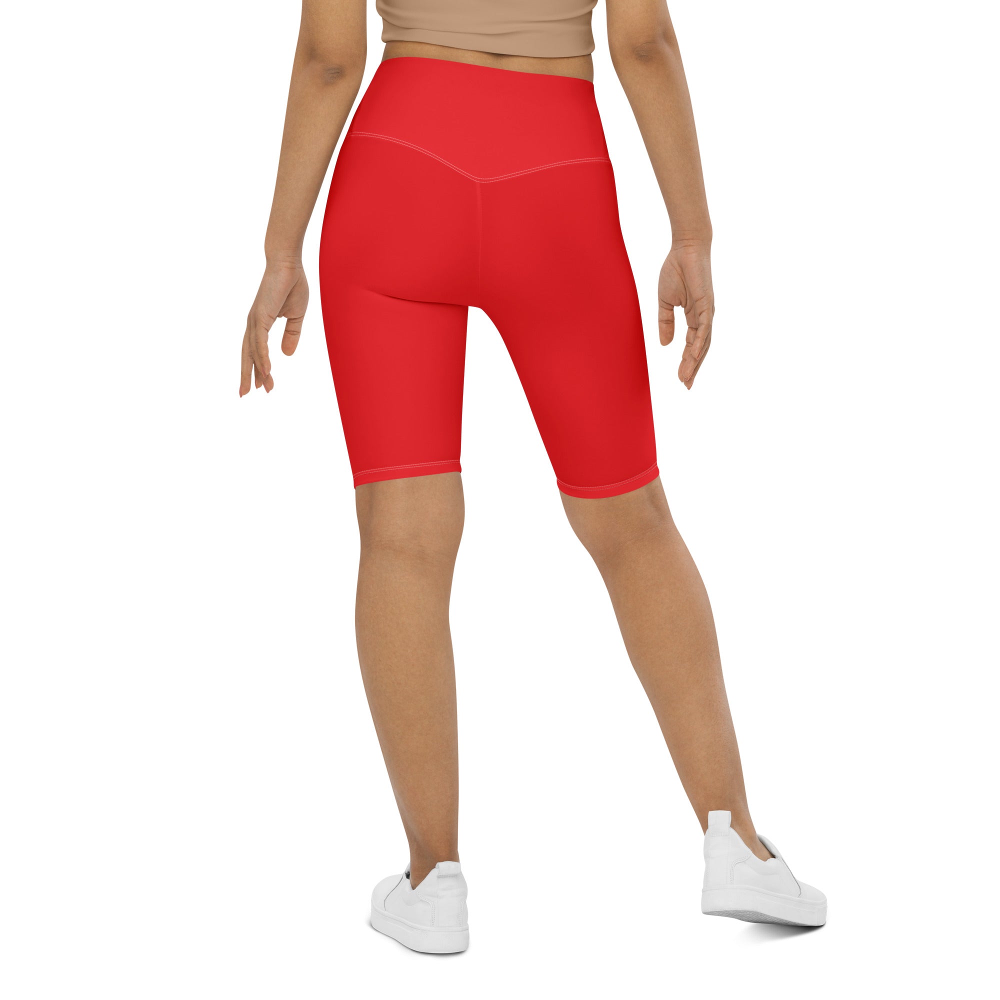 Women’s red high waisted biker shorts made of stretchy moisture wicking fabric for active fit workouts