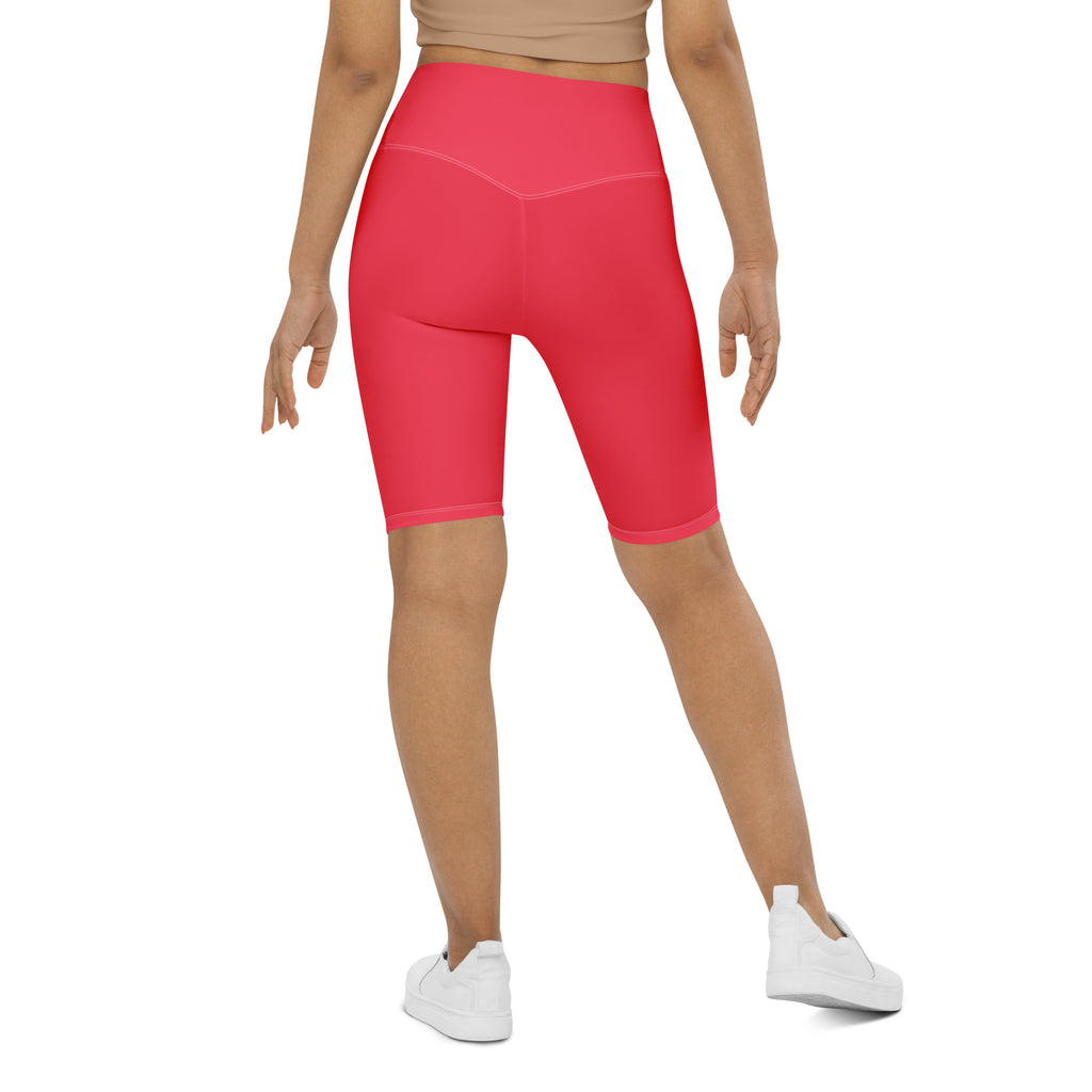 Bright pink high waisted biker shorts with smooth stretchy moisture wicking fabric for active fit workouts