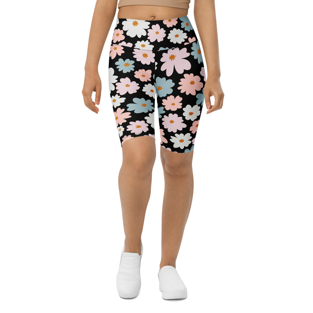 Women’s retro floral high waisted biker shorts in black with pink white blue blossoms and moisture wicking fabric