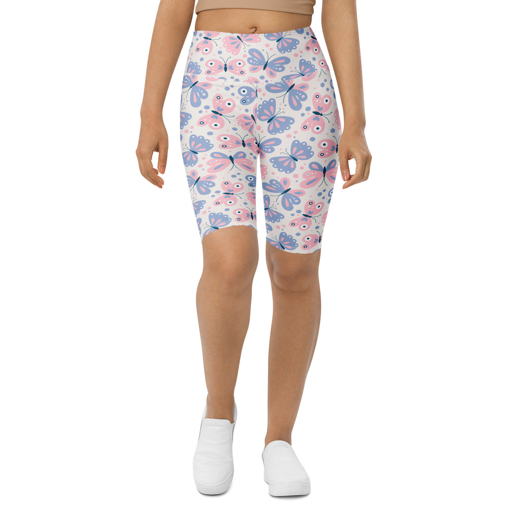 Women’s butterfly print high waisted biker shorts in pink and blue with moisture wicking active fit fabric
