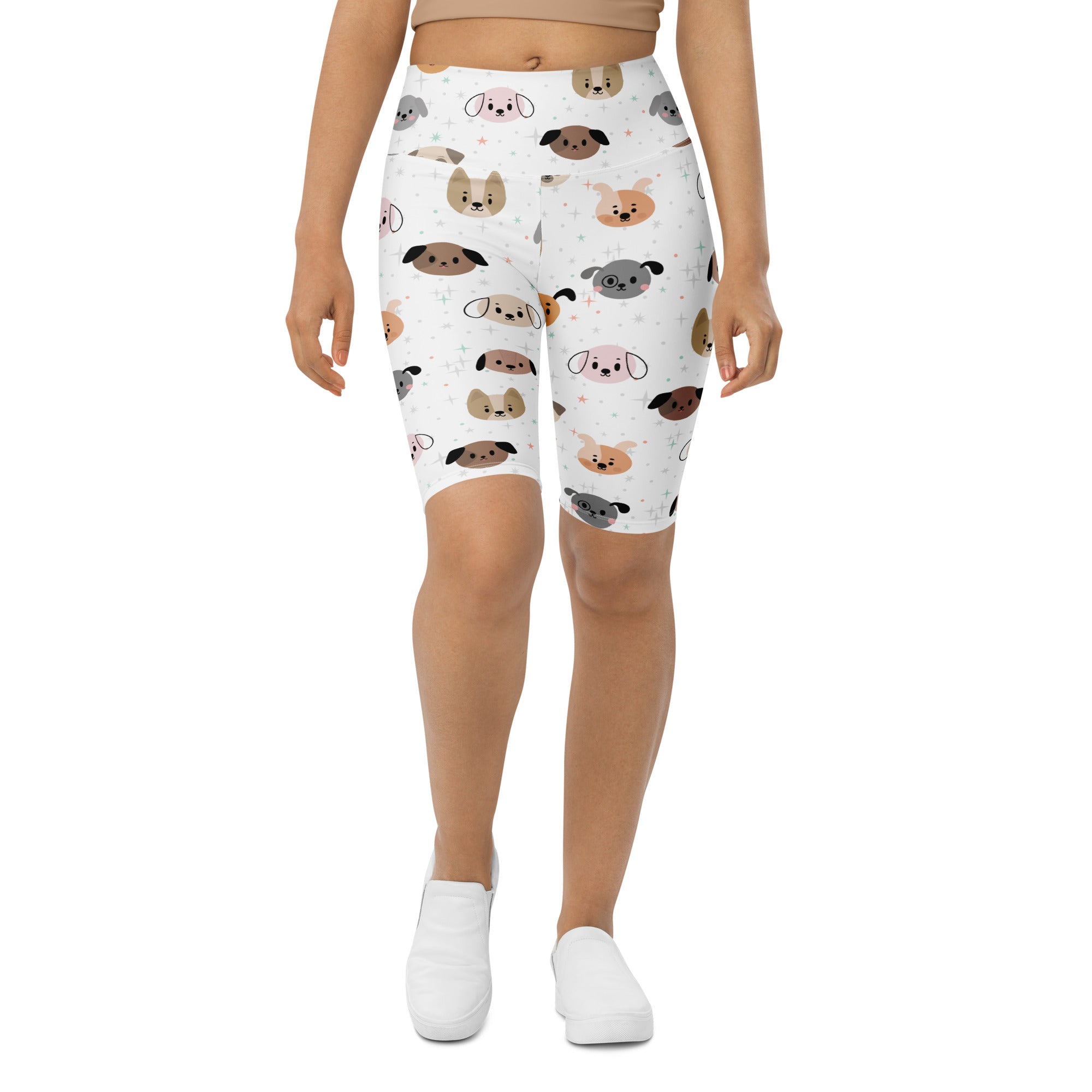 White women’s high waisted biker shorts with playful cartoon dog pattern and moisture wicking active fit material