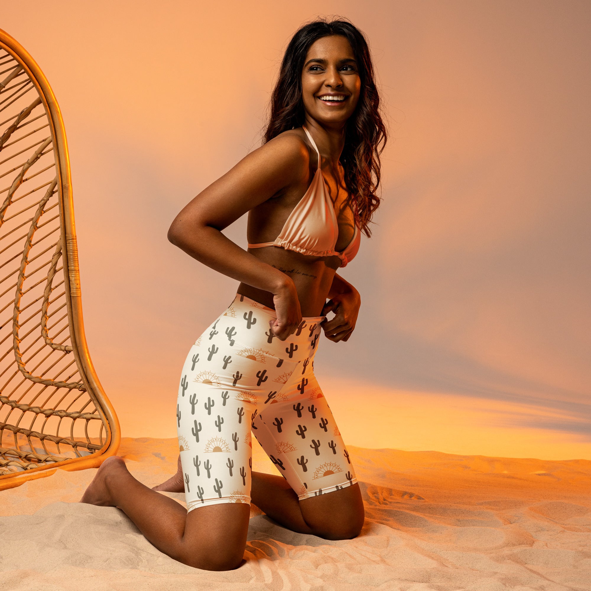 White high waisted biker shorts with black cactus and sun motifs moisture wicking active fit for women
