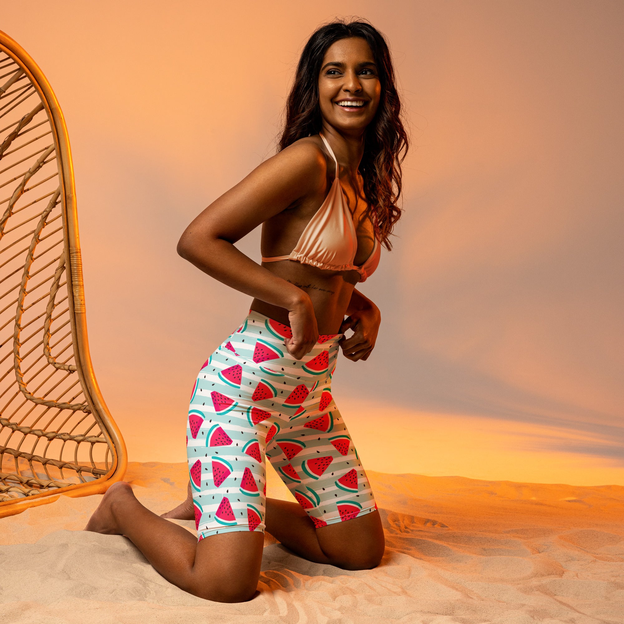 Women’s watermelon stripe high waisted biker shorts in white with vibrant red and green slices, moisture wicking active fit