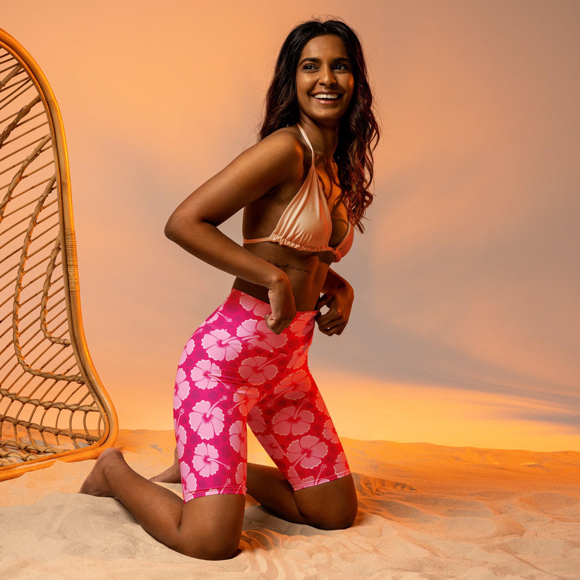 Women’s pink hibiscus high waisted biker shorts with moisture wicking fabric for active fit and comfort